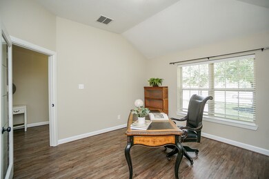 A custom glass pane door opens to this gorgeous executive study. You could use this space now more than ever!