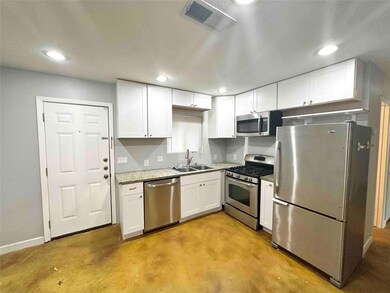 Kitchen featuring appliances with stainless steel