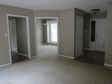 Entry. The foyer opens to family room, dining room and kitchen. Half bath is located off foyer.