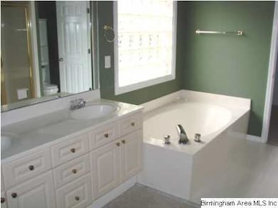 Master bathroom with twin vanity area, garden tub,