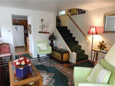 Living Room. Open stairway in living room.