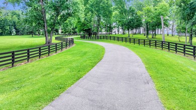 4 board fencing both sides of drive