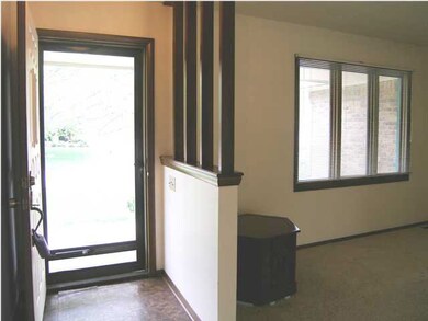 The foyer welcomes from the covered front porch.