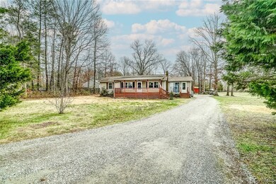 View of front of house with a front yard and covered porch