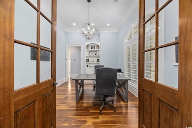 Office area with crown molding, dark hardwood / wo