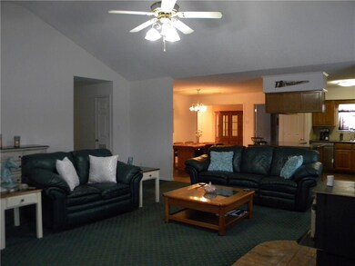 Another view of the living room/dining and kitchen