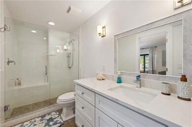 Bathroom with tile patterned floors, vanity, toile