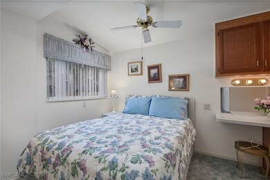 Bedroom featuring carpet floors, baseboards, and c