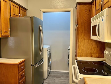 Refrigerator, washer, dryer included with applianc