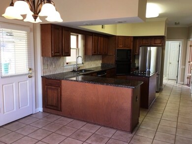 Updated Kitchen offers expanded granite counter to