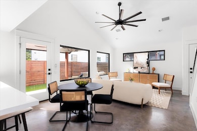 Dining area featuring finished concrete floors, h