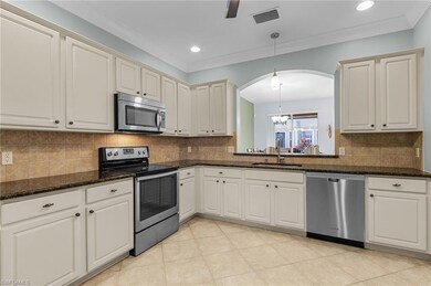 Kitchen featuring pendant lighting, appliances wit