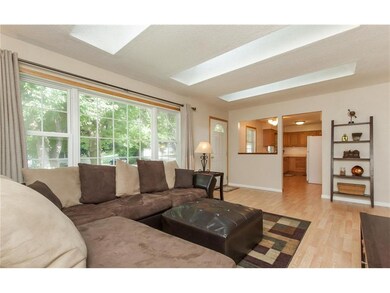 Skylights and large front window provide lots of n