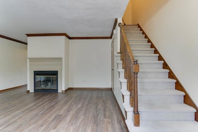 Family room with new LVP flooring and fireplace