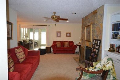 The Sun Room opens to the Living Room and Dining R