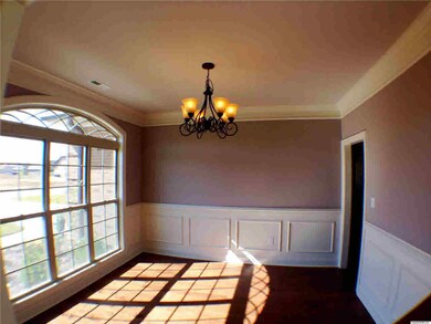LARGE FORMAL DINING ROOM WITH BEAUTIFUL EXTENSIVE TRIM WORK!
