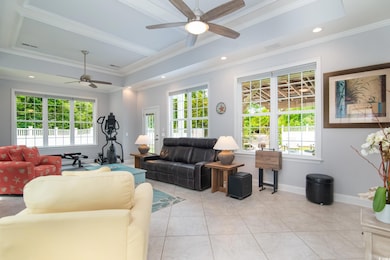 Living room with a wealth of natural light, a ceil