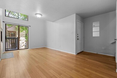 Unfurnished living room with light wood-type floo