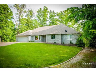 Exterior Front. Luscious trees surrounding this home