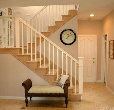 Lovely formal staircase. Entry features newer ston