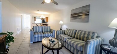 Living room featuring ceiling fan, showing dining