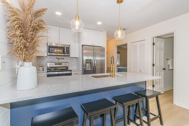 Kitchen with light hardwood / wood-style flooring,