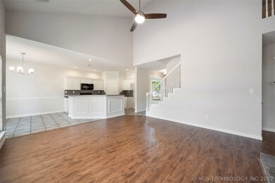 Great Room opens to Kitchen & Dining.