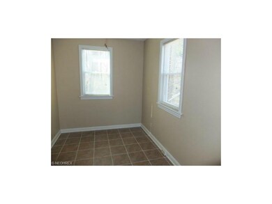 Dining room with tile floor. Unit 716