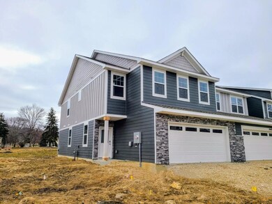 Ellsworth Exterior before driveway and sidewalk.