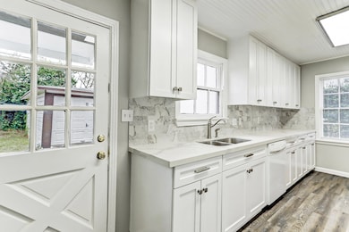 Remodeled Kitchen boasts marble counters & backspl