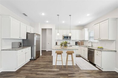 Kitchen featuring appliances with stainless steel 