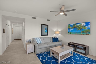 Living room featuring light tile patterned floors