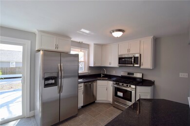 Kitchen With Sliding Door to Deck.