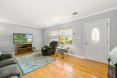 Living Room - fresh paint, crown molding and wood 