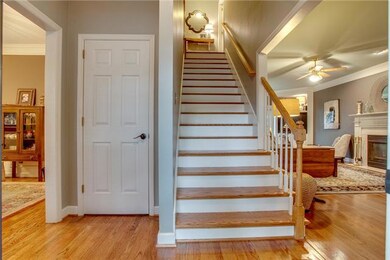 Welcome to hardwoods throughout the main level, and new hardwood stairs. Oil-bronzed hardware is also featured throughout the home.