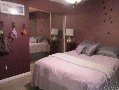 Large mainfloor bedroom features dual sliding mirr