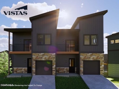 Contemporary home featuring stone siding, a balcon