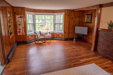 ATTRACTIVE BAY WINDOW OVERLOOKS WOODED LOT
