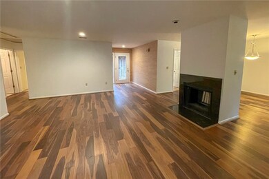 Living room looking back at foyer, fireplace that
