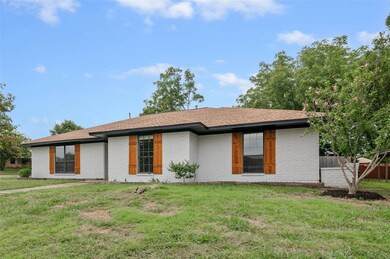 Ranch-style home with a front lawn