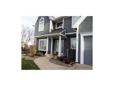 Pillared Front Porch With Front Mullioned Windows