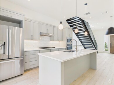 Kitchen featuring appliances with stainless steel
