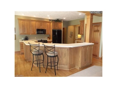 Center island opening to family room.
