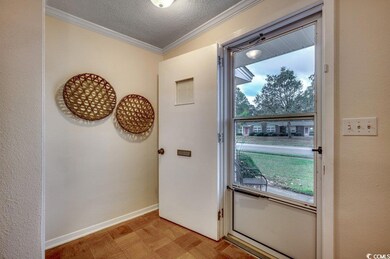 Doorway to outside with ornamental molding, a text