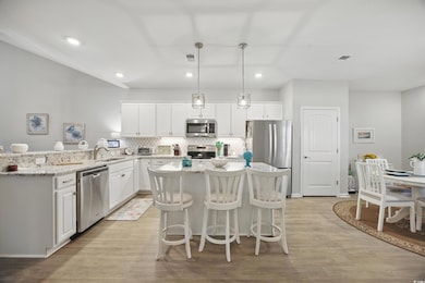Kitchen with appliances with stainless steel finis