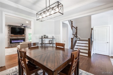 Open Dining Room with Trey ceiling, electric behin