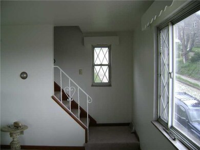 Living Room. View of stairway to second floor
