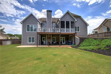 Back of house featuring a patio area, a fenced backyard, a screened porch, a chimney, and a wooden deck