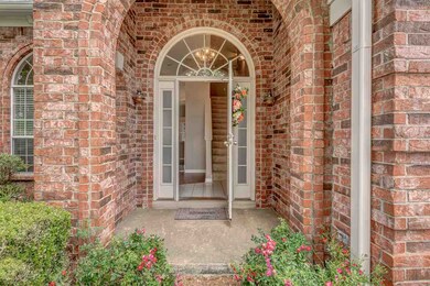 Welcome to 10001 Woodland Birch Drive! Front door 