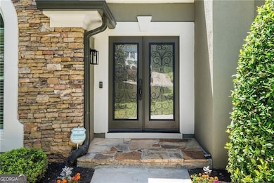 You are greeted by the beautiful designer front doors and freshly landscaped front yard
